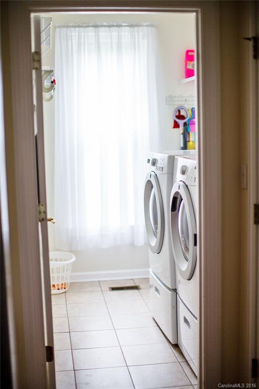 12521 Hawks Ridge Road Huntersville, NC 28078 - Photo 22 of 24 a storage room with washer and dryer