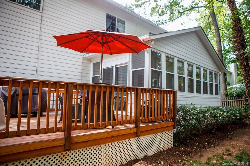 12521 Hawks Ridge Road Huntersville, NC 28078 - Photo 23 of 24 a view of a balcony with a potted plant and wooden fence