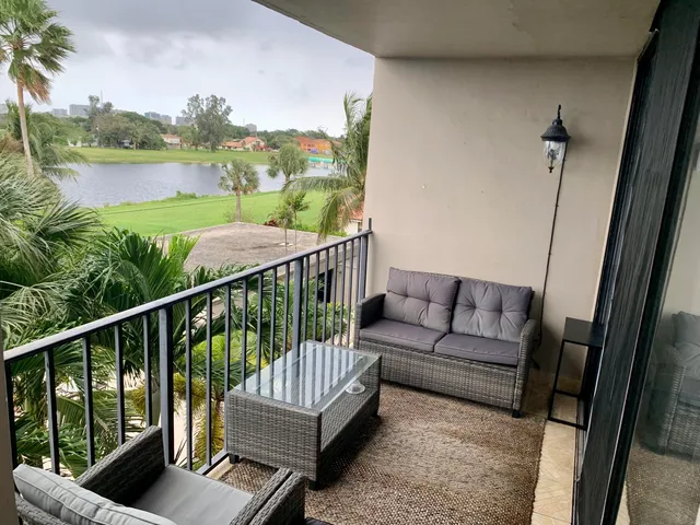 a view of a balcony with furniture