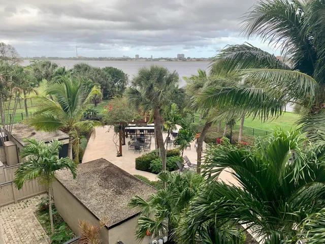 a bedroom with a bed and large window