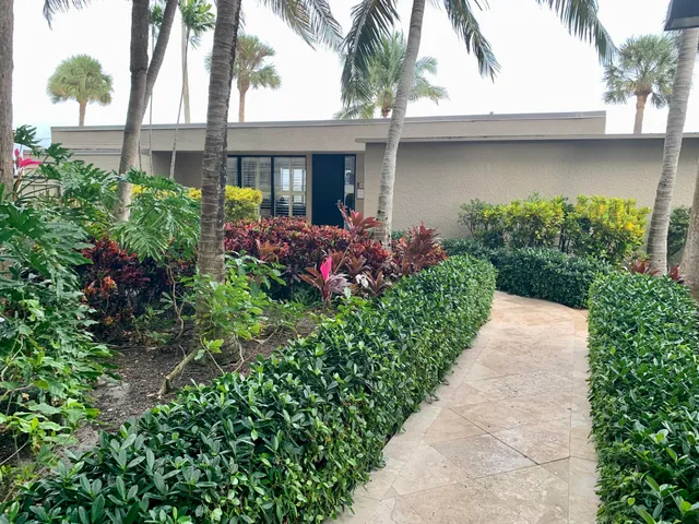 a view of swimming pool with a table and chairs