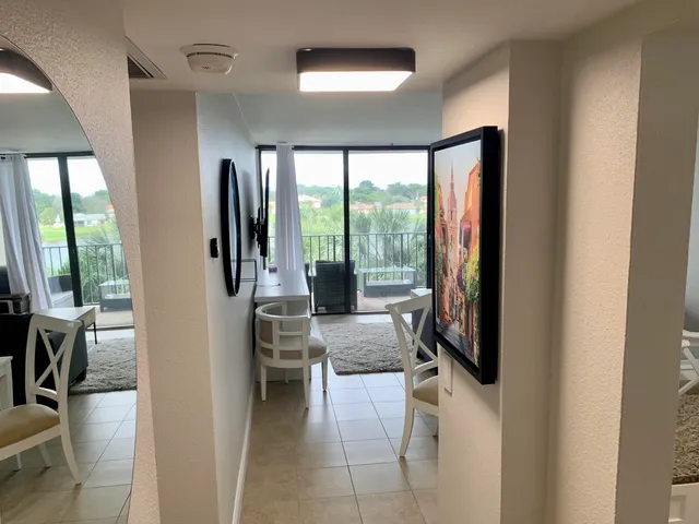 a kitchen with stainless steel appliances granite countertop a refrigerator stove and microwave