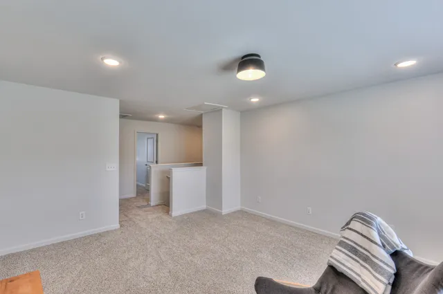 a view of walk in closet with clothes