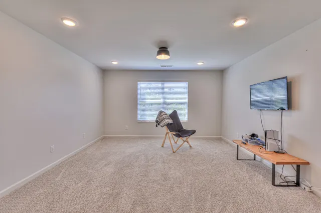 a bedroom with a bed and a table in it