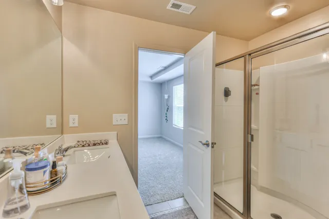 a view of a hallway with a wooden floor