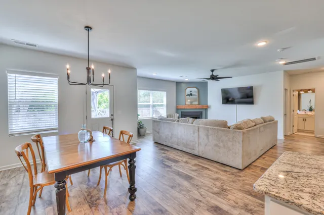 a view of a room with furniture window and wooden floor