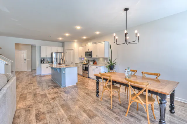 a view of a livingroom with furniture and a flat screen tv