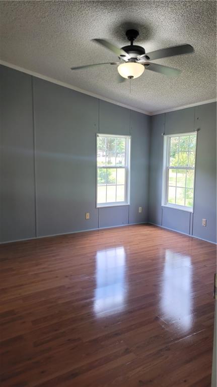 174 Luther Circle Villa Rica, GA 30180 - Photo 16 of 32 a view of an empty room with wooden floor and a window