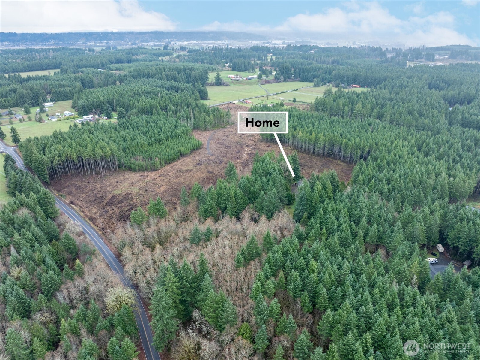 143 Berry Road Chehalis, WA 98532 - Photo 13 of 13 a view of a city with lush green forest
