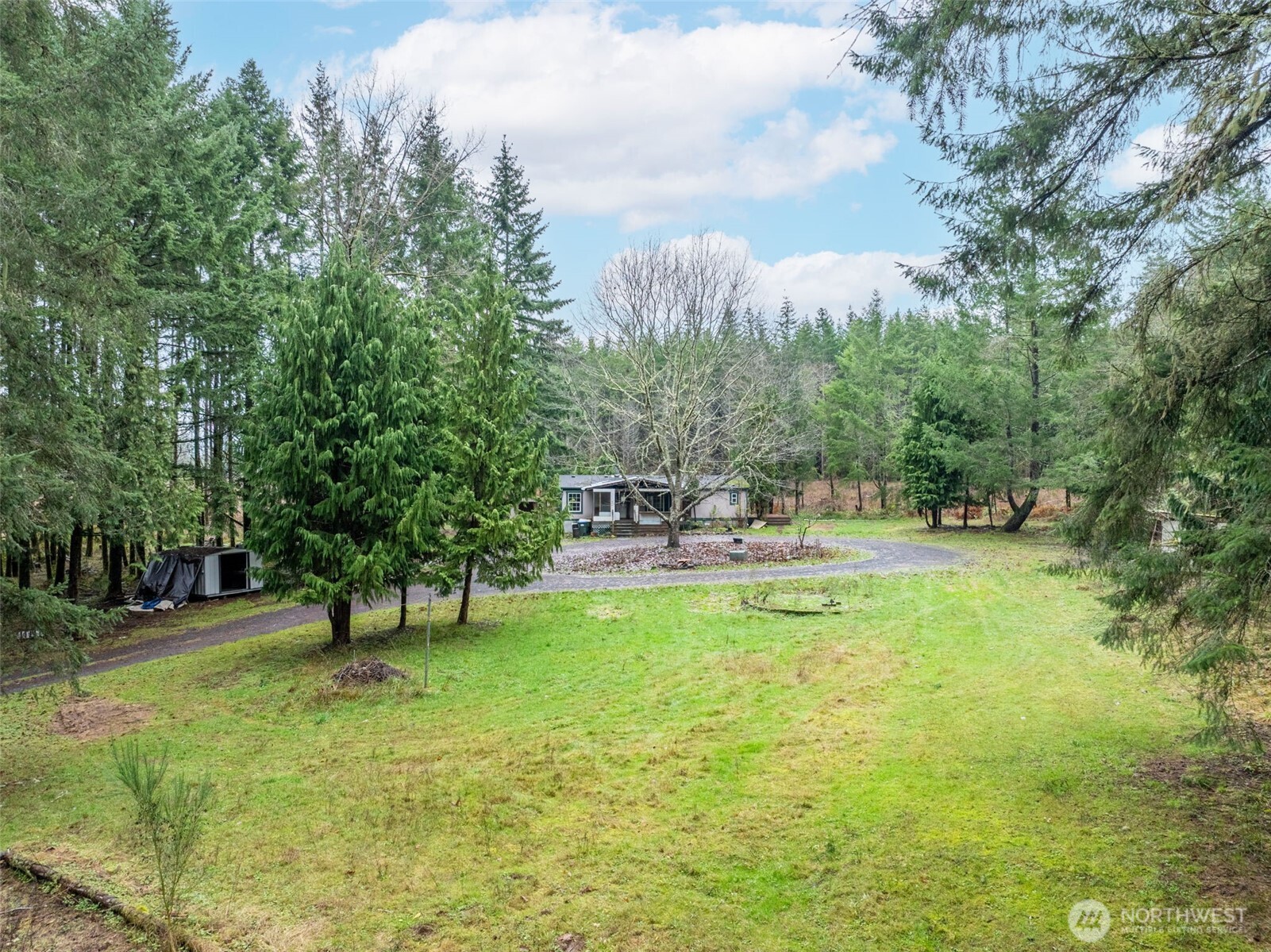 143 Berry Road Chehalis, WA 98532 - Photo 9 of 13 a swimming pool with outdoor seating and trees