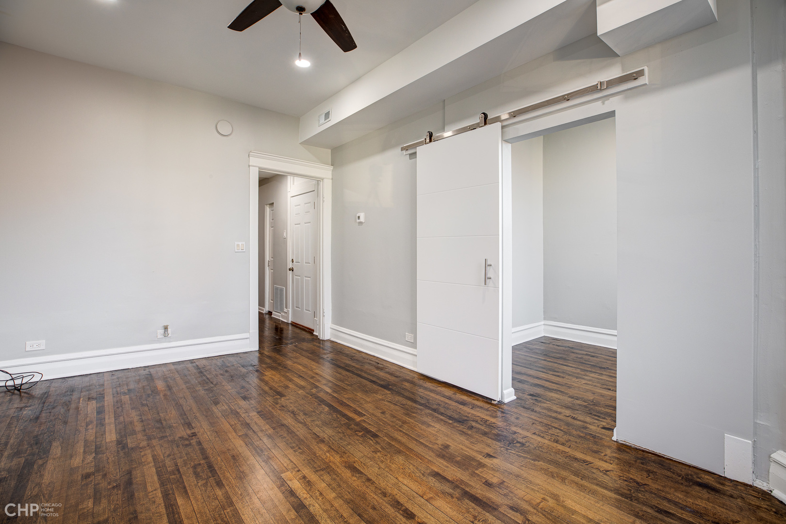 2623 West 21st Place Chicago, IL 60608 - Photo 21 of 29 a view of an empty room and wooden floor