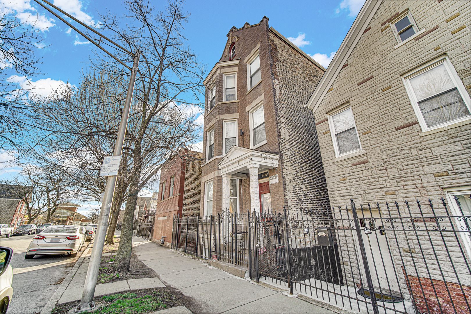 2623 West 21st Place Chicago, IL 60608 - Photo 3 of 29 a view of a brick house with many windows