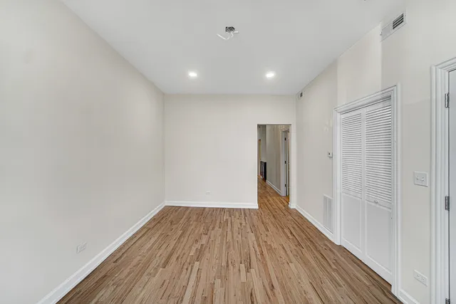 a view of hallway with wooden floor