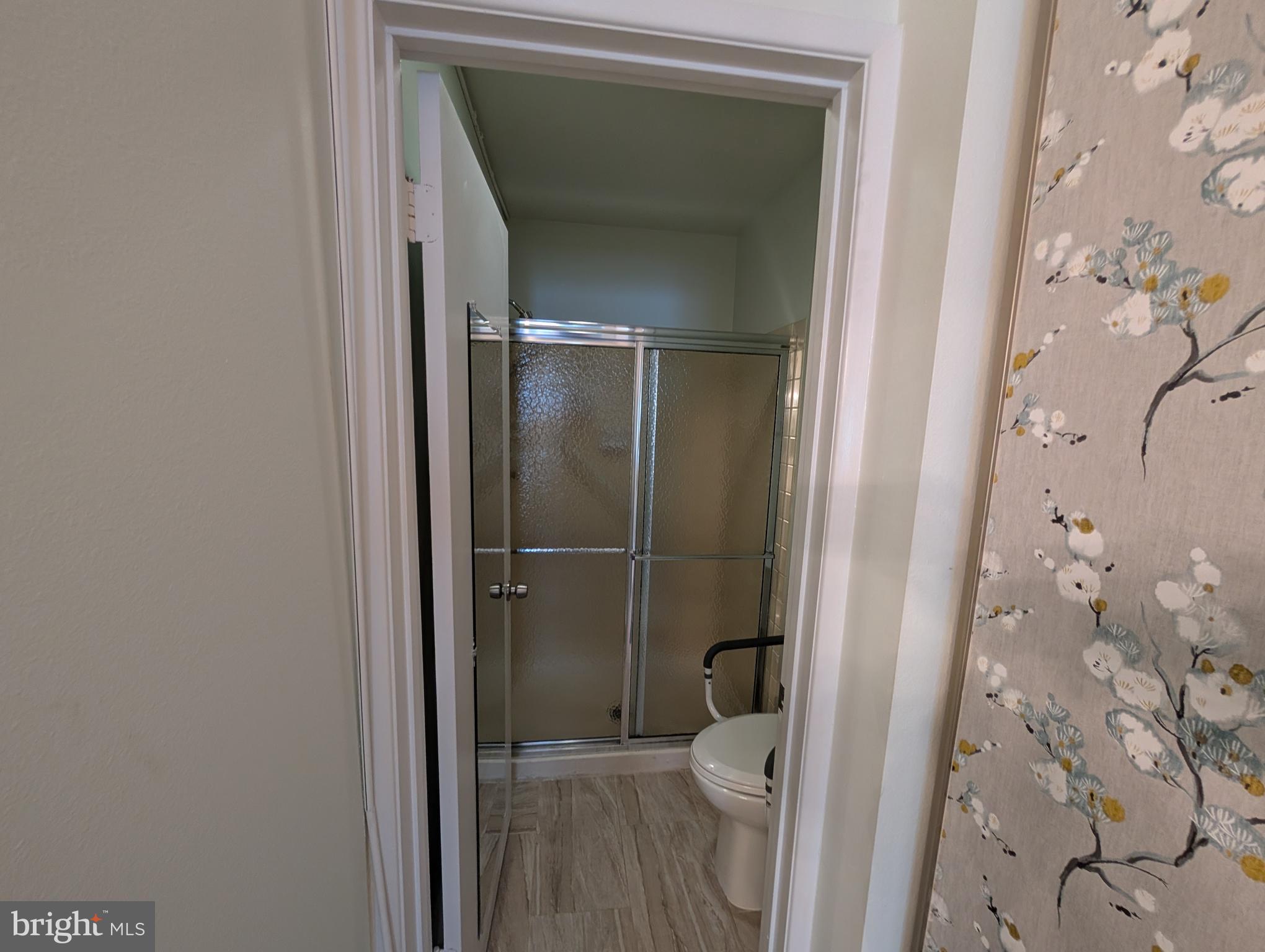 15401 Bassett Lane, Unit 452E Silver Spring, MD 20906 - Photo 15 of 26 a bathroom with a toilet and a shower