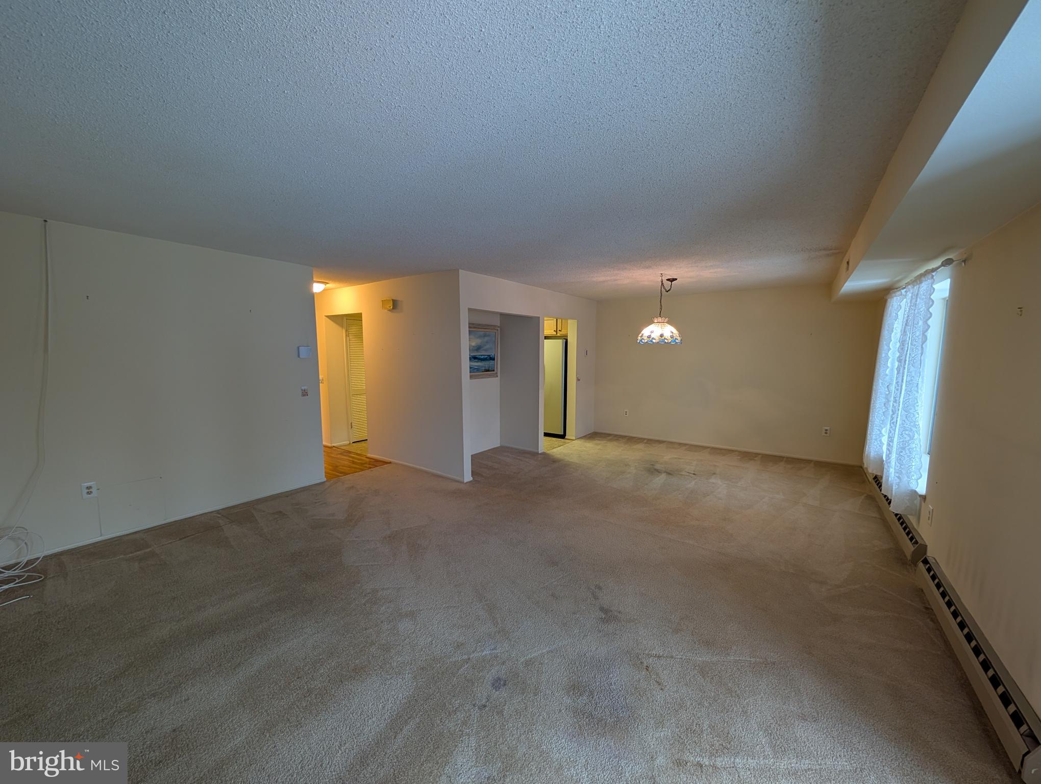 15401 Bassett Lane, Unit 452E Silver Spring, MD 20906 - Photo 23 of 26 a view of an empty room with a window