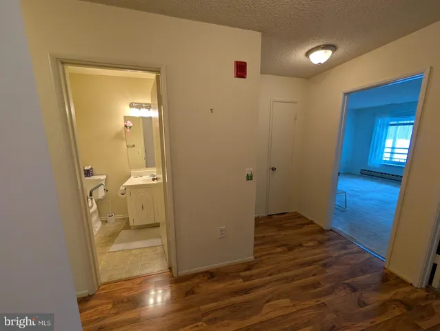 an empty room with a windows and closet