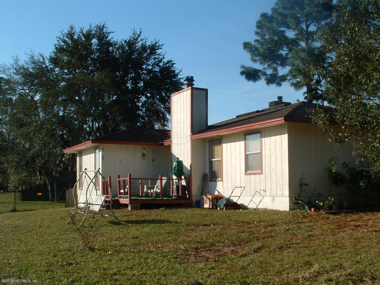 1777 Derringer Road Jacksonville, FL 32225 - Photo 2 of 3 a view of a house with backyard and a tree