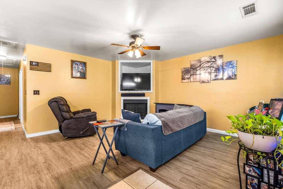 281 Northwinds Boulevard Carrollton, GA 30117 - Photo 10 of 15 a living room with furniture flowerpot and wooden floor