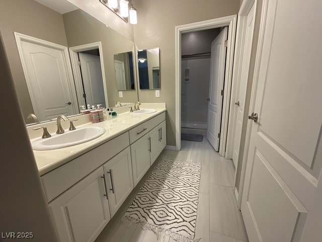 Undisclosed Address Henderson, NV 89011 - Photo 12 of 30 Upstairs 2nd full bathroom with double vanity and a shower stall