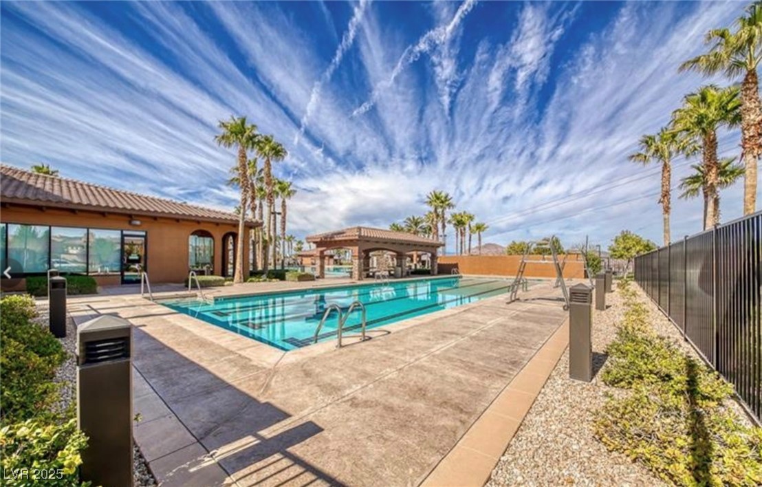 Undisclosed Address Henderson, NV 89011 - Photo 25 of 30 Community pool featuring a patio area