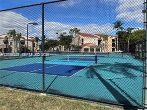 2113 Renaissance Boulevard, Unit 203 Miramar, FL 33025 - Photo 18 of 19 a view of a tennis court
