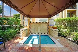 2113 Renaissance Boulevard, Unit 203 Miramar, FL 33025 - Photo 19 of 19 a room with garden and patio
