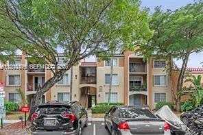 2113 Renaissance Boulevard, Unit 203 Miramar, FL 33025 - Photo 2 of 19 a car parked in front of a houses