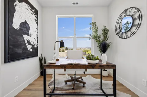 a view of a workspace with furniture