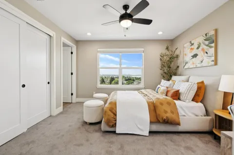 a spacious bedroom with a bed and a window