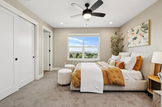a spacious bedroom with a bed and a window