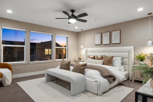 a spacious bedroom with a bed and window