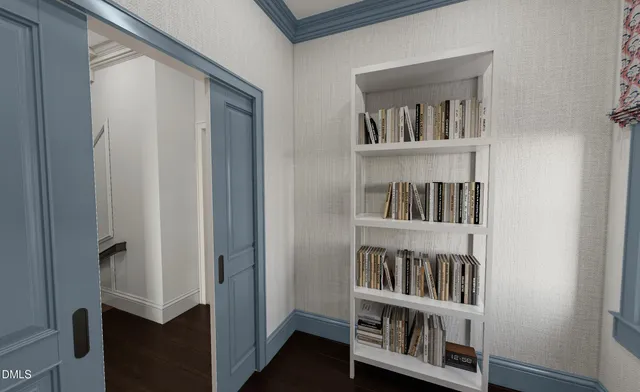 a bed sitting in a bedroom next to a window