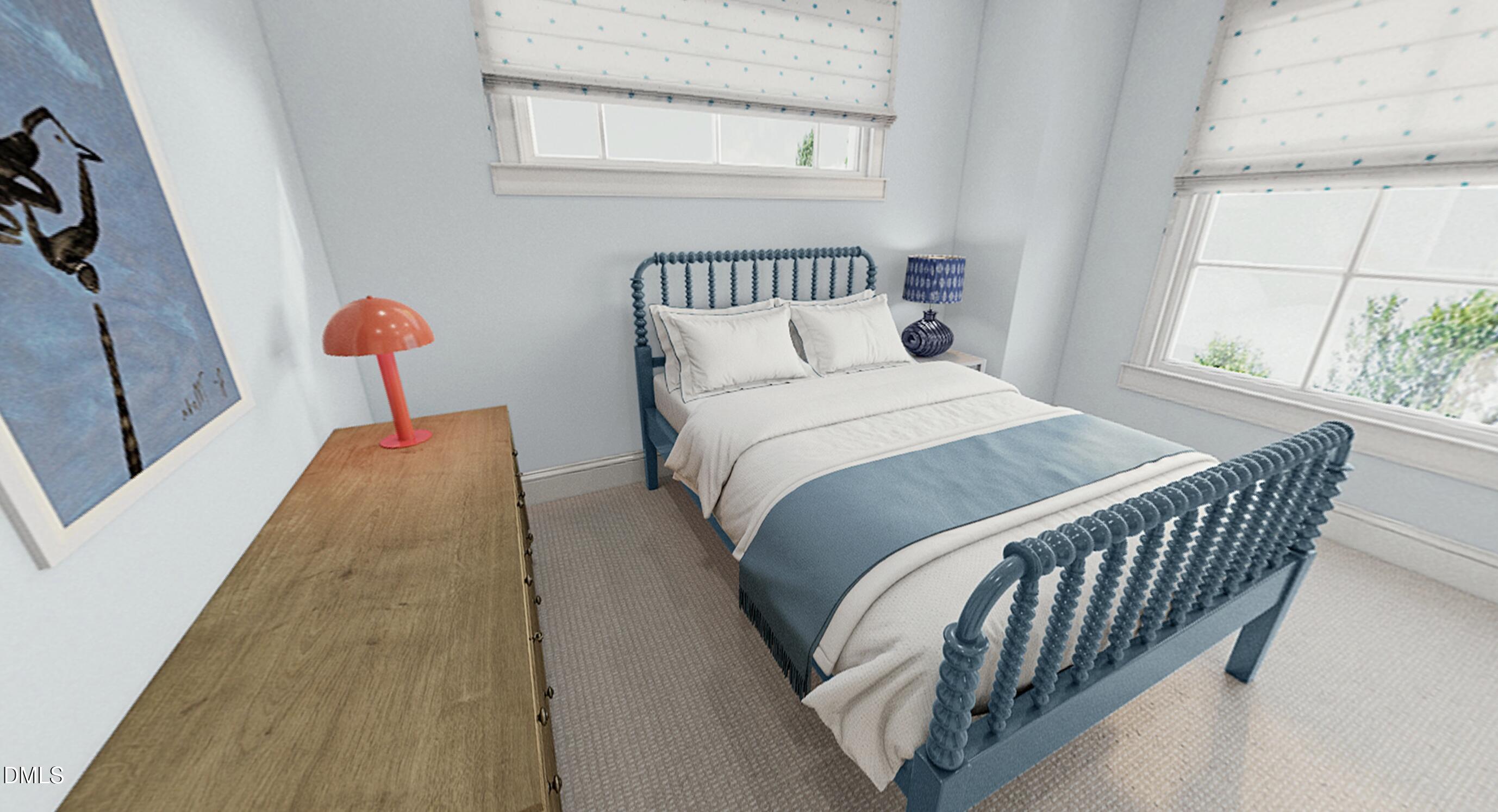 1321 Chester Road Raleigh, NC 27608 - Photo 14 of 21 a bed sitting in a bedroom next to a window