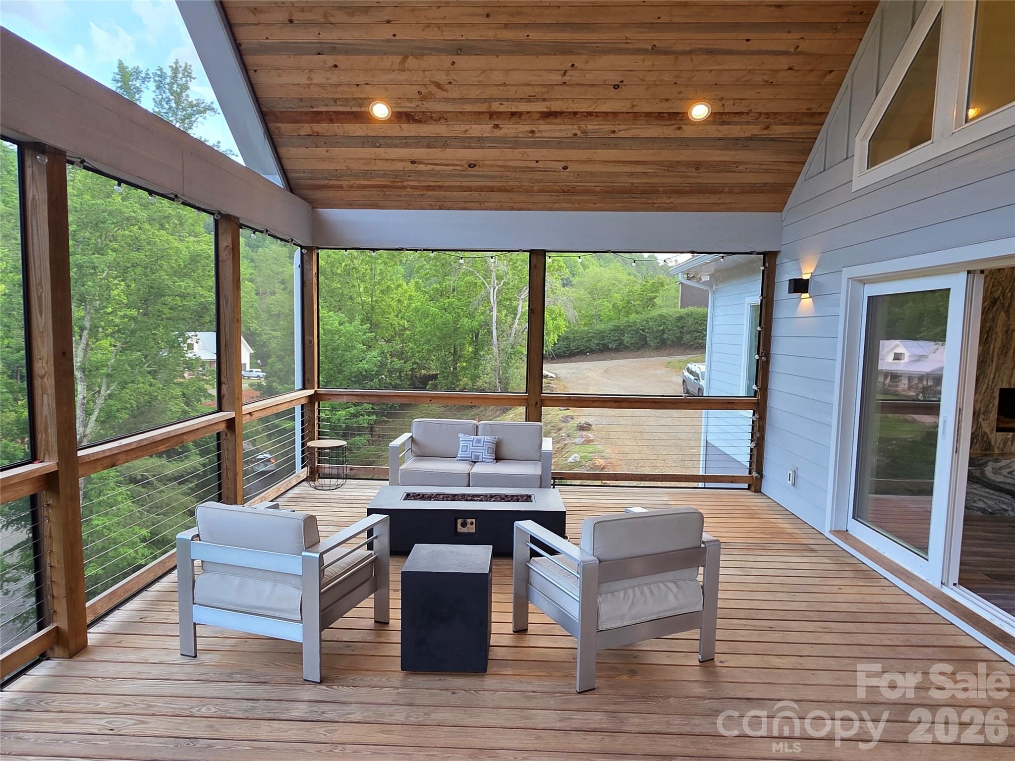123 Israel Road Candler, NC 28715 - Photo 36 of 44 a view of a patio with wooden floor