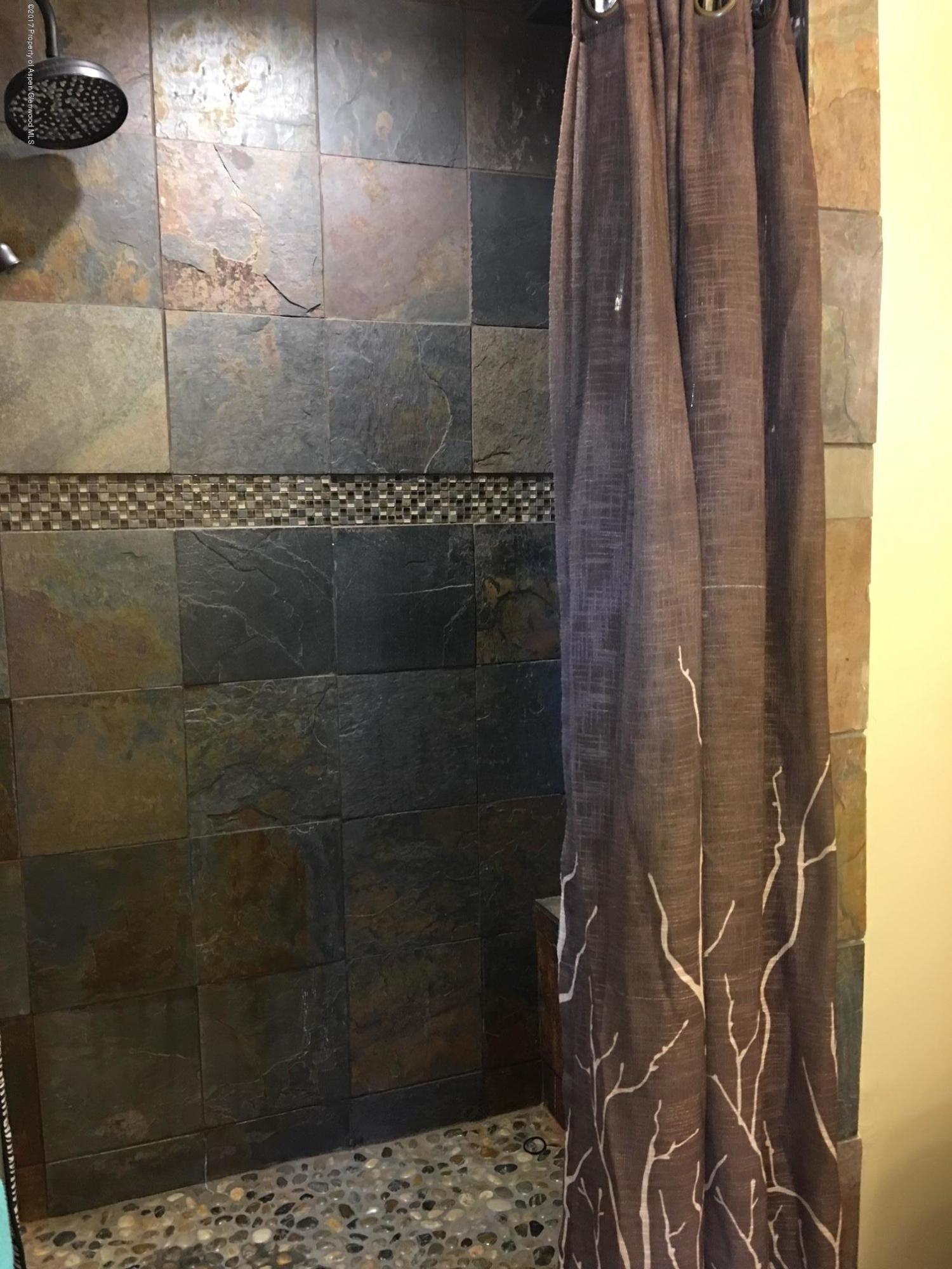 2405 Fairway Avenue, Unit 15 Rifle, CO 81650 - Photo 10 of 15 bathroom tiled shower