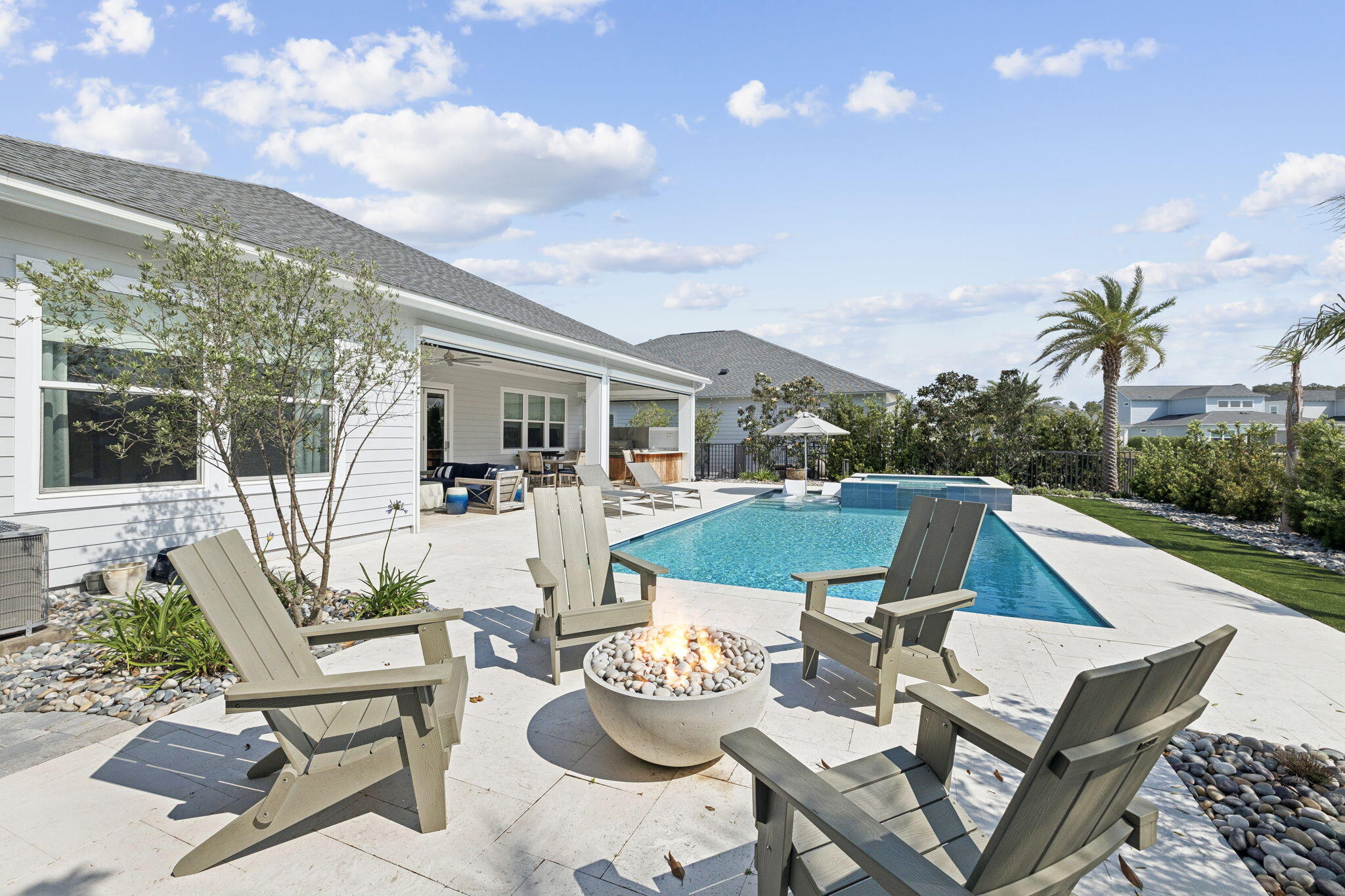 70 River Rise Way Inlet Beach Inlet Beach, FL 32461 - Photo 41 of 59 a view of a patio with couches table and chairs and potted plants