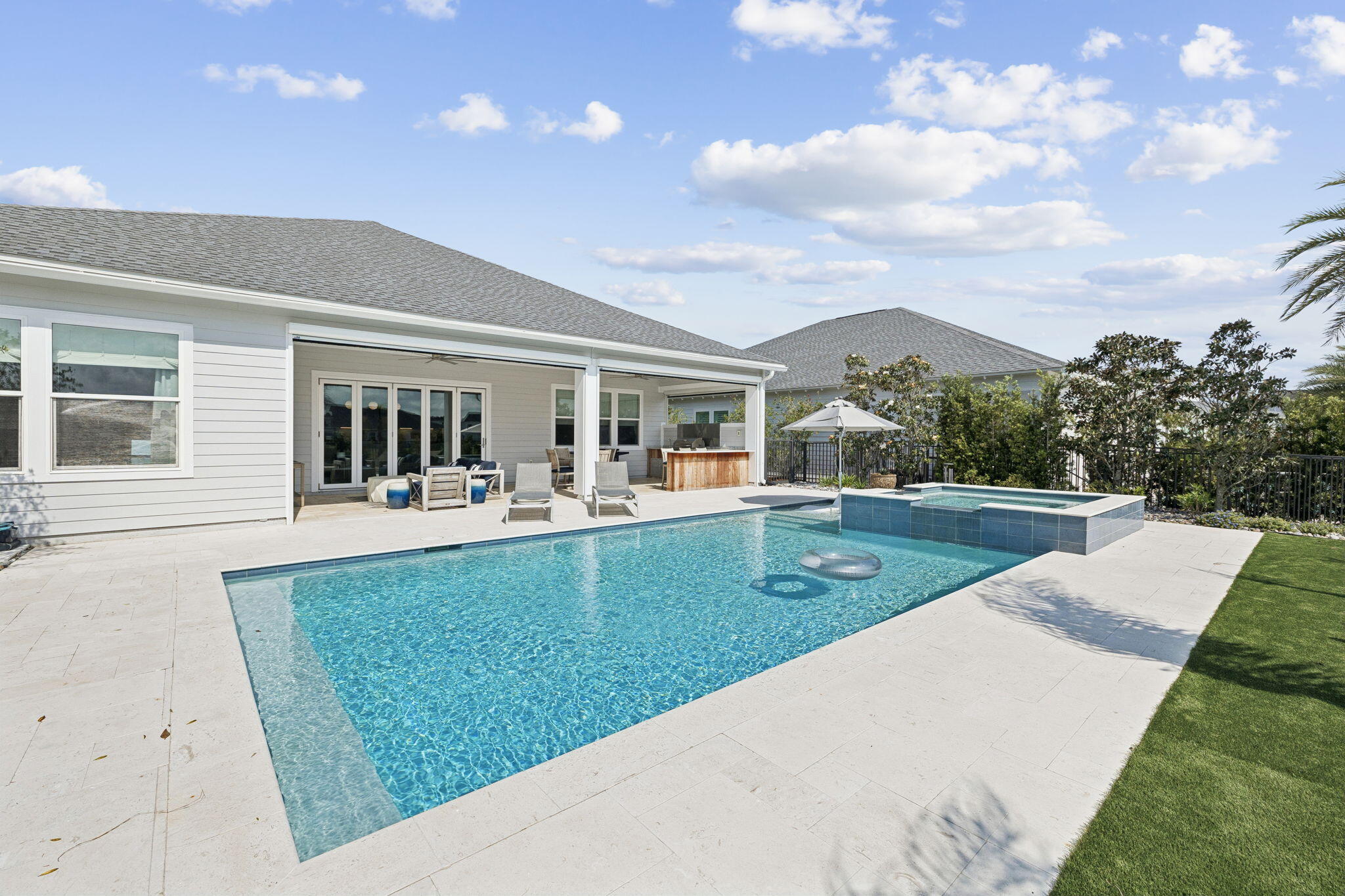70 River Rise Way Inlet Beach Inlet Beach, FL 32461 - Photo 43 of 59 a view of a patio with couches and table with wooden floor and fence