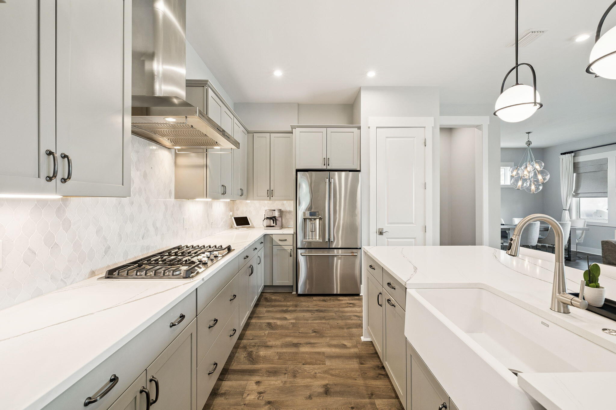 70 River Rise Way Inlet Beach Inlet Beach, FL 32461 - Photo 8 of 59 a large white kitchen with stainless steel appliances granite countertop a sink and cabinets