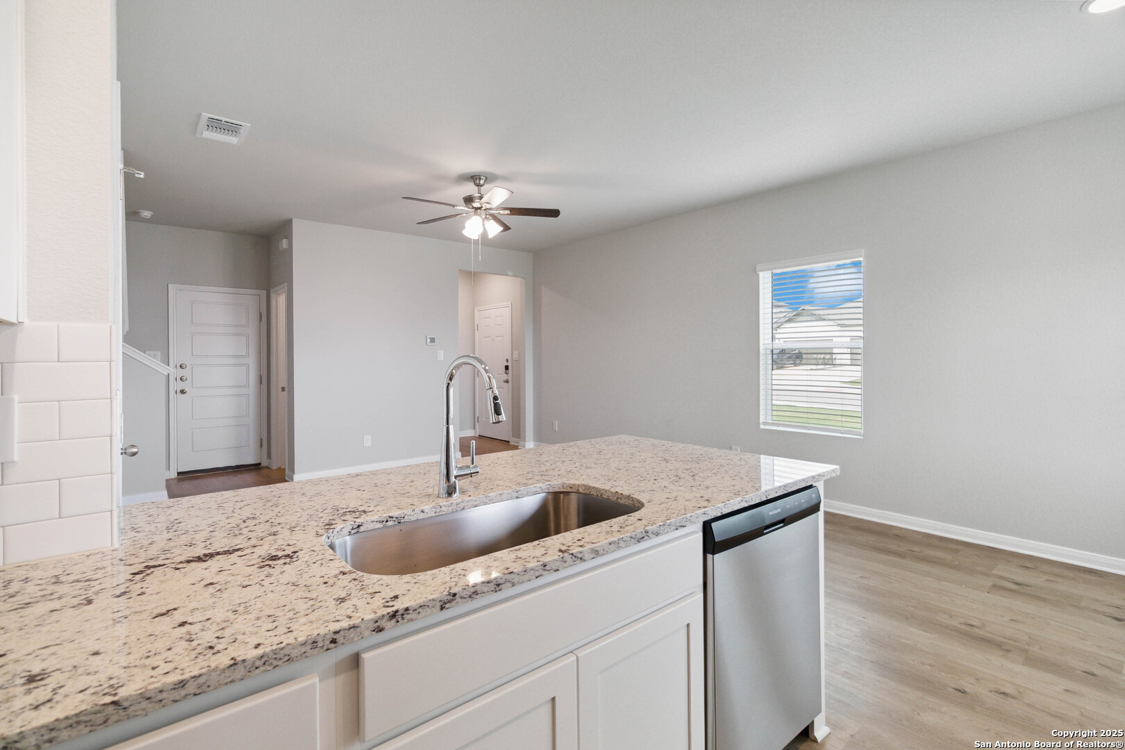 5406 Devils Gate Converse, TX 78109 - Photo 13 of 28 a kitchen with a sink cabinets and wooden floor