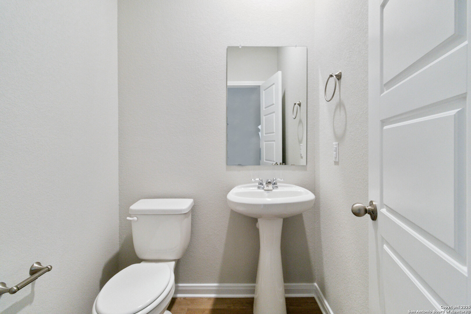 5406 Devils Gate Converse, TX 78109 - Photo 23 of 28 a bathroom with a toilet sink and mirror