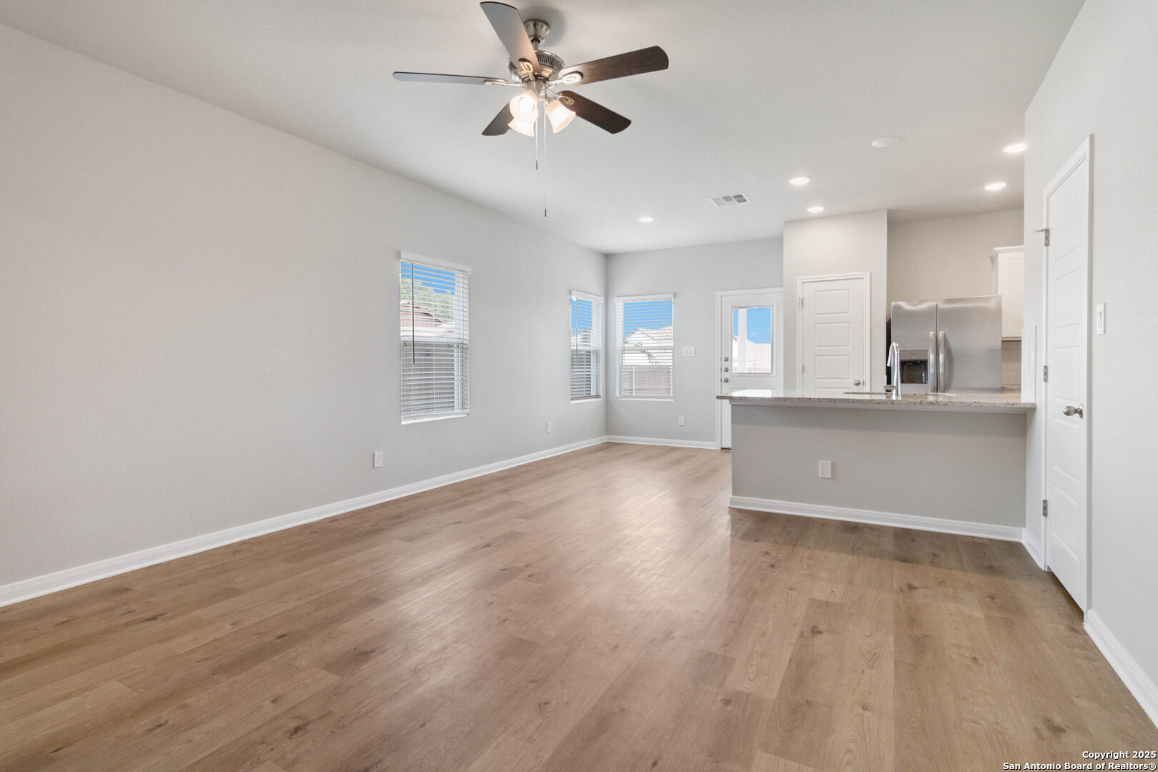 5406 Devils Gate Converse, TX 78109 - Photo 7 of 28 a view of a kitchen with wooden floor and a kitchen