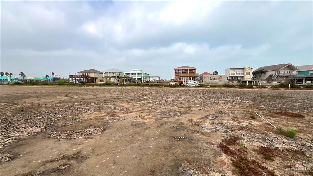 0 Bass Avenue Port Isabel, TX 78578 - Photo 4 of 6 a view of a lake with houses in the back