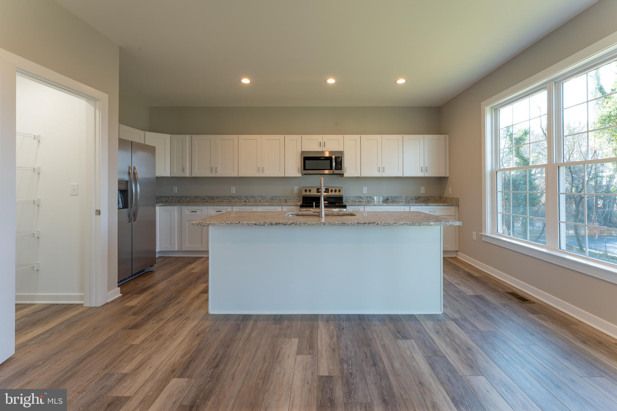 501 Harrison Circle Locust Grove, VA 22508 - Photo 13 of 58 White cabinets, granite tops