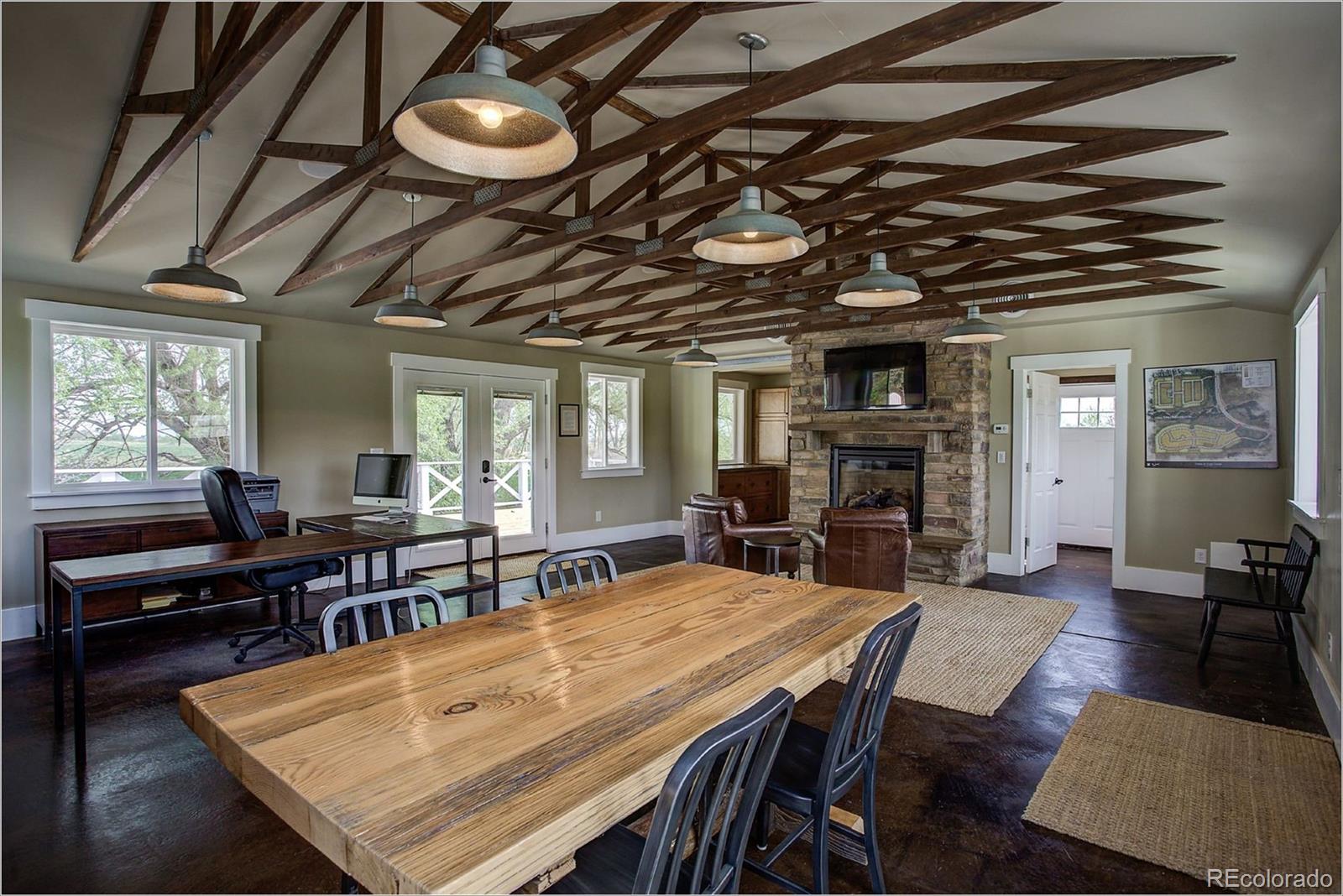 10261 Arapahoe Road Lafayette, CO 80026 - Photo 11 of 35 a view of a dining room with furniture