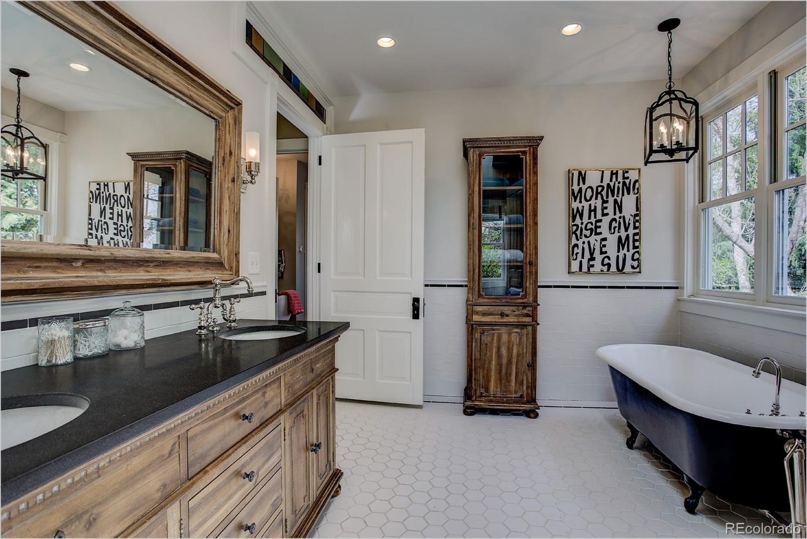 10261 Arapahoe Road Lafayette, CO 80026 - Photo 24 of 35 a view of hall way with furniture and chandelier