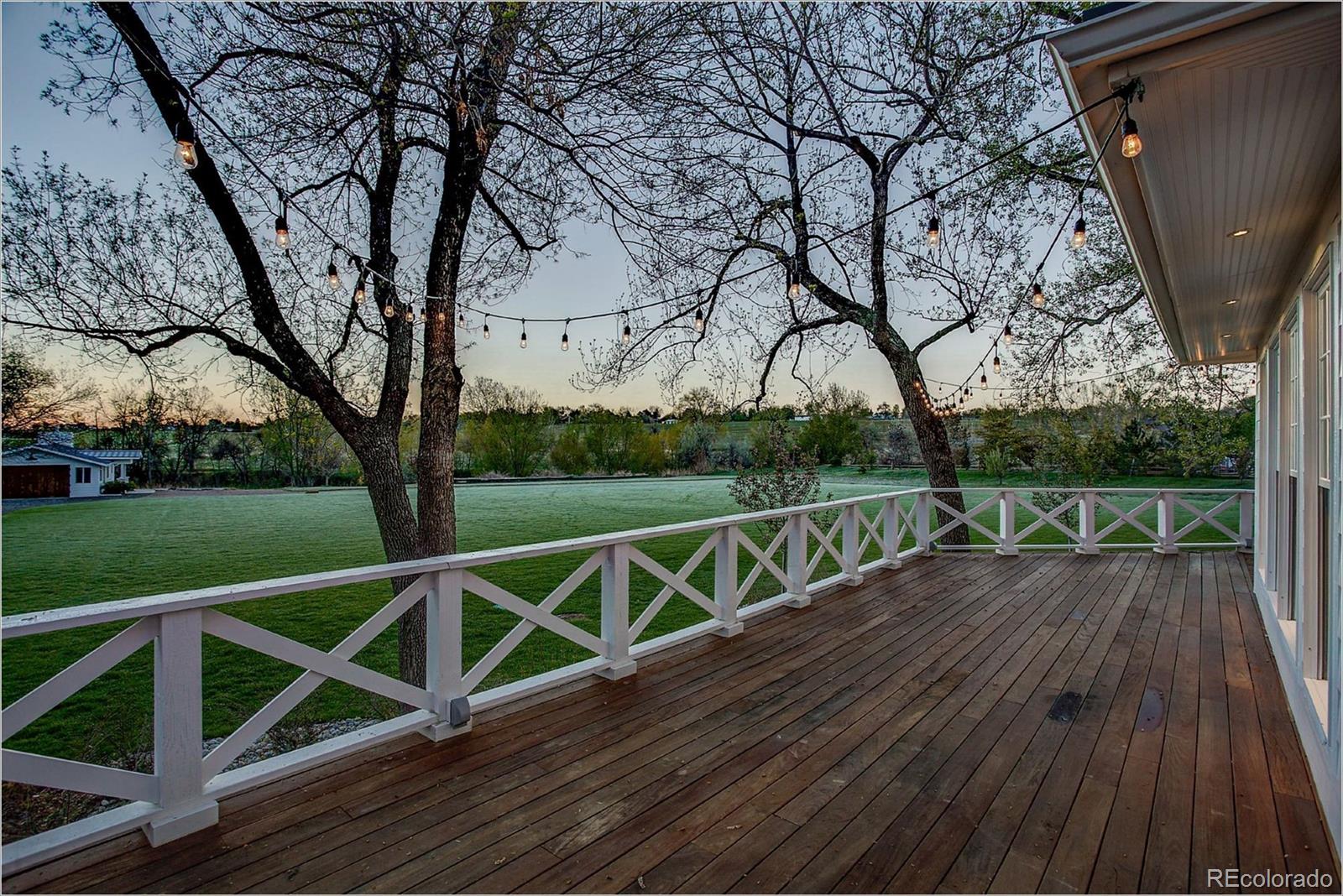 10261 Arapahoe Road Lafayette, CO 80026 - Photo 35 of 35 a view of balcony with wooden floor and fence