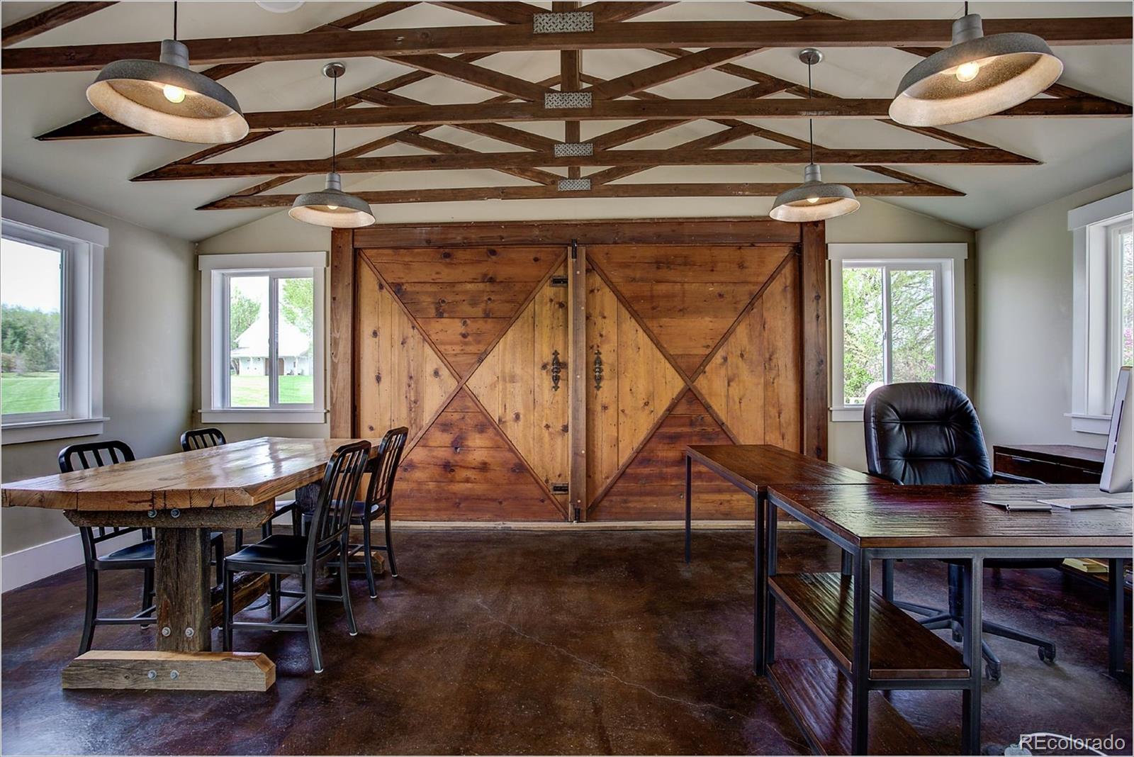 10261 Arapahoe Road Lafayette, CO 80026 - Photo 10 of 35 a dining room with wooden floor table and chairs