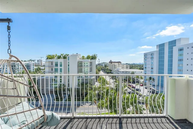 a view of balcony with furniture