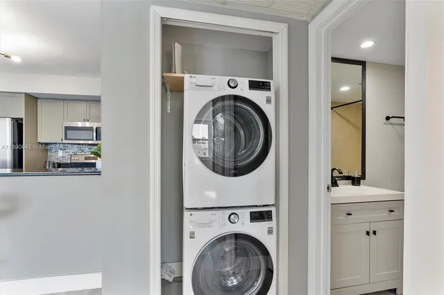 a view of a hallway with washer and dryer