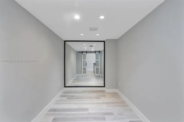 a view of an empty room and window